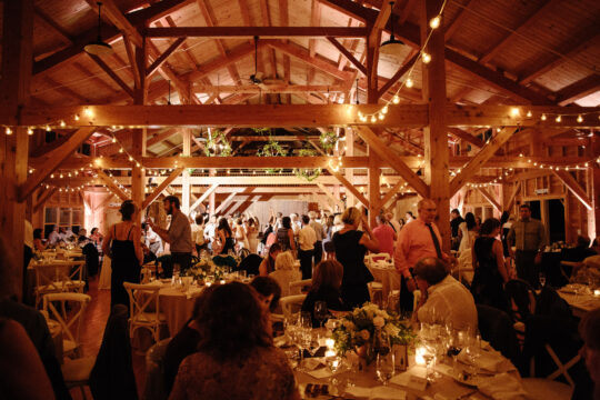 Our 8,000 square foot building boasts cathedral ceilings, exposed post and beams, oak floors, and a sweeping wrap-around porch, making it the ultimate showstopper for any wedding reception.